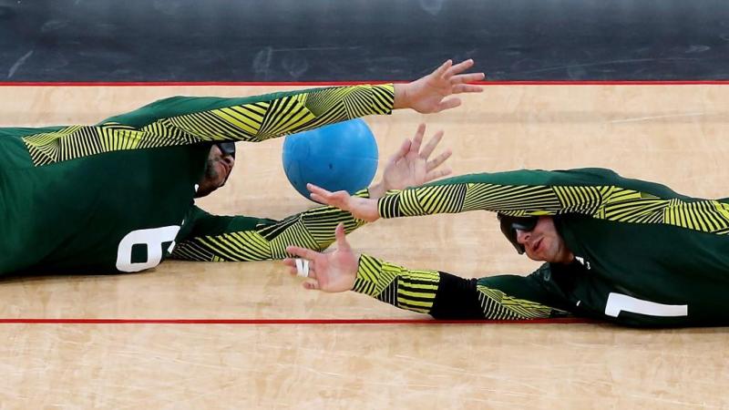Jose Roberto Ferreira de Oliveira (R) and Romario Diego Marques of Brazil fail to stop a goal during the Men's Group A Goalball match between Finland and Brazil at the London 2012 Paralympic Games. 