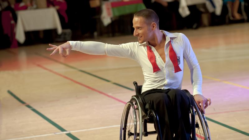 Man in wheelchair doing a dancing pose