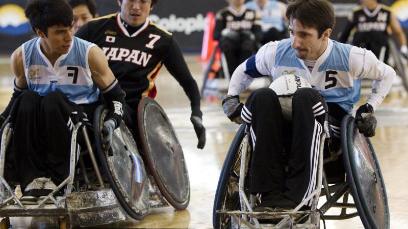 wheelchair rugby players on the field
