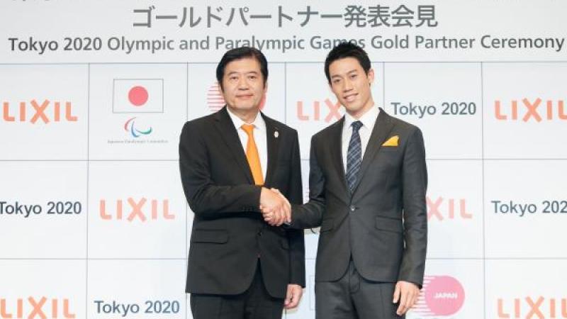 Two men shaking hands after sponsorship deal