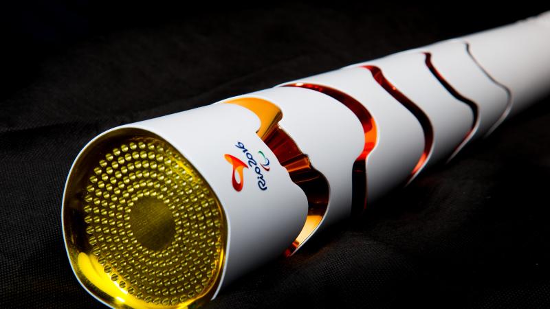 Rio 2016 Paralympic Torch design is white with red, orange circles. 
