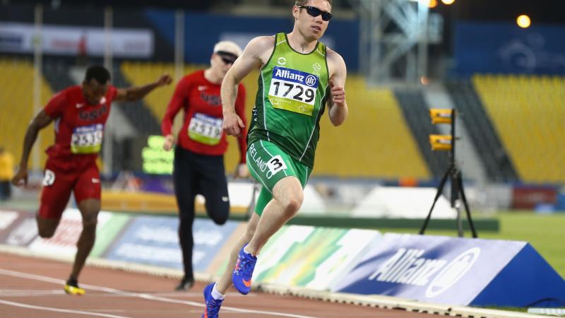 a male competing for Ireland wearing green clothes