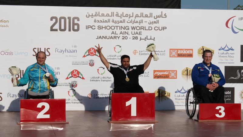 Three para-sport shooters celebrate their medals