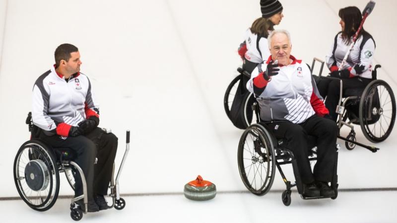 Jim Armstrong; Canada Skip and his team on the ice