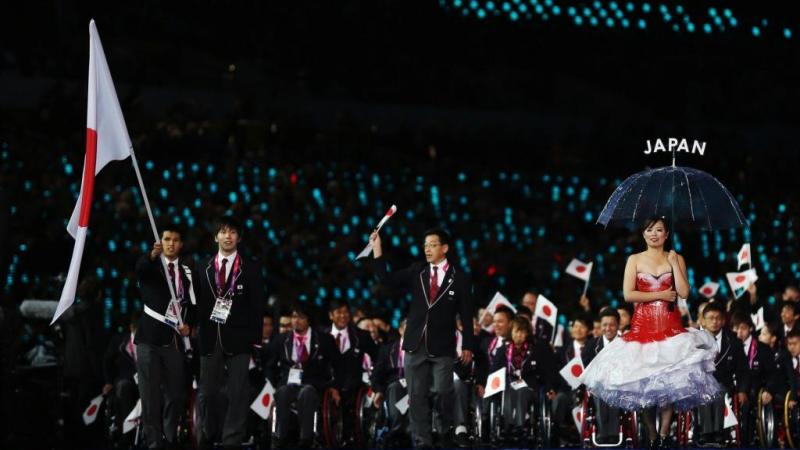 Swimmer Keiichi Kimura of Japan carries the flag during the Opening Ceremony of the London 2012 Paralympic Games.