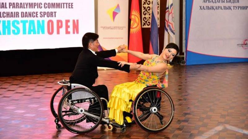 Man and woman in wheelchairs dancing