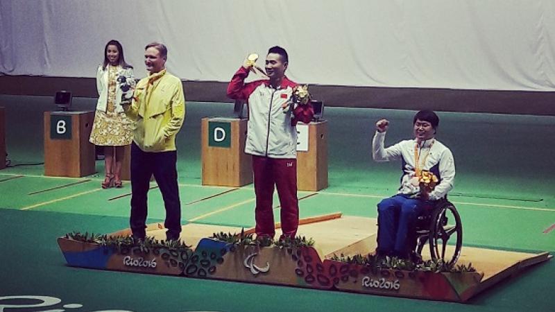 Xing Huang celebrates shooting gold medal win in Rio 2016