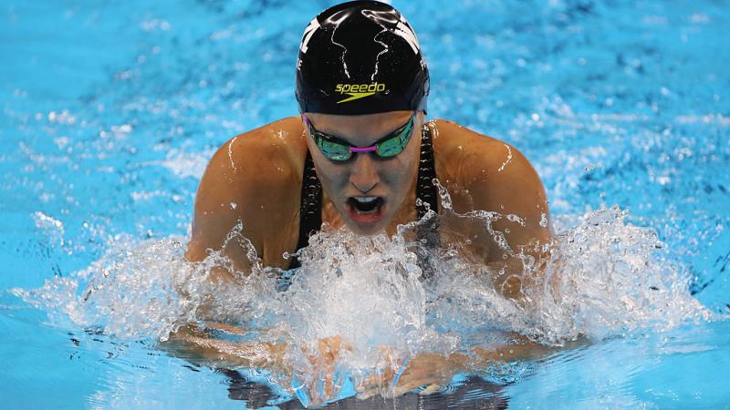 Close up of swimmer doing breast stroke