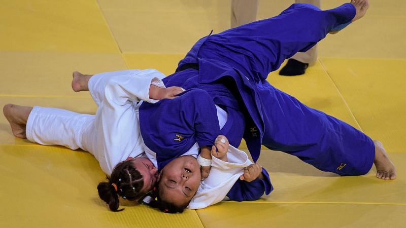 Yanping Yuan (blue) of China with Alimova Khayitjon of Uzbekistan during the Women +70 kg Judo Gold Medal match on Day 3 of the Rio 2016 Paralympic Games