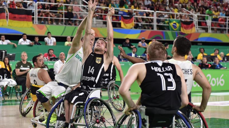 male wheelchair basketballer Thomas Boehme challenging for the ball