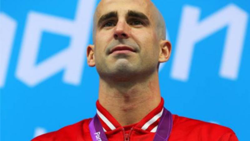 A picture of a man during a medal ceremony