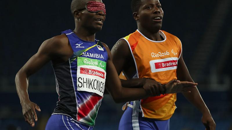 Ananias Shikongo and his guide Even Tjiviju of Namibia celebrates winning the gold medal in the Men's 200m - T11 Final at the Rio 2016 Paralympic Games.