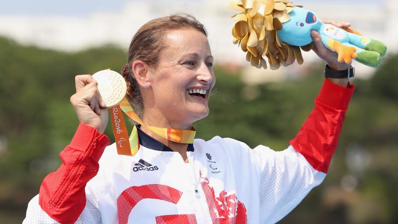 Great Britain's Anne Dickens celebrates on the medals podium after winning the women's KL3 canoe final at the Rio 2016 Paralympic Games.