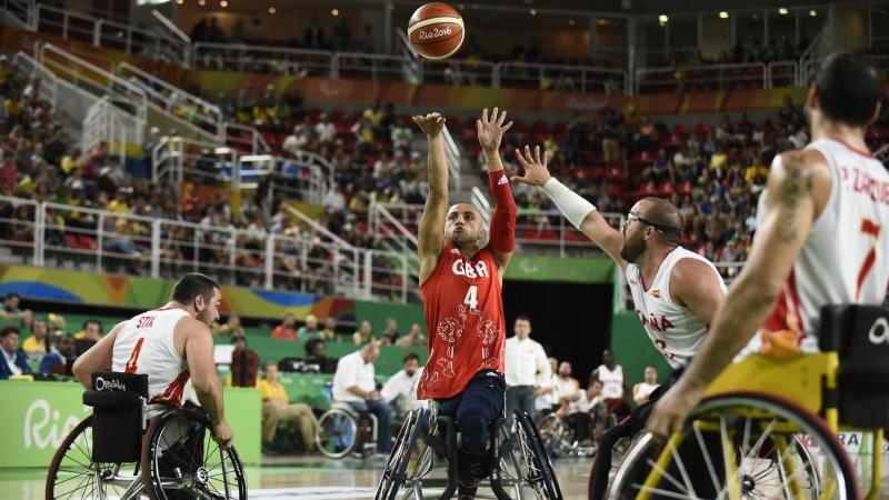 wheelchair basketball male players fight for the ball