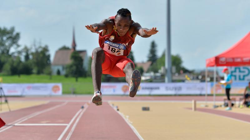Man competing in long jump event