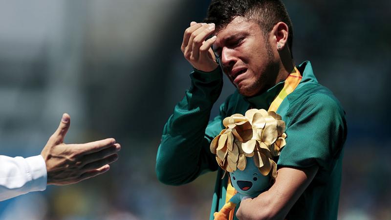 a Para athlete cries on the podium