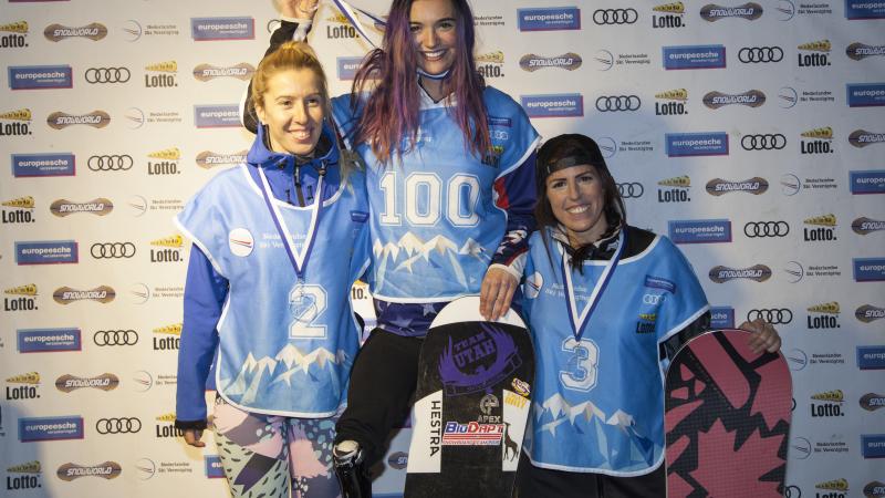 three female Para snowboarders on the podium
