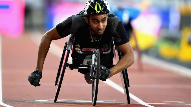 Walid Ktila of Tunisia crosses the line to win the Mens 200m T34 final at the London World Para Athletics Championships.