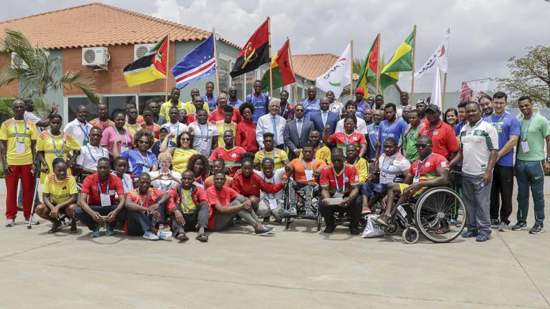 Around 50 participants of Agitos Foundation training camp pose for a group picture in Luanda, Angola