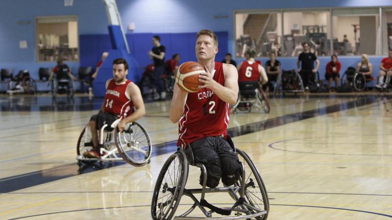 a male wheelchair basketballer goes to take a shot