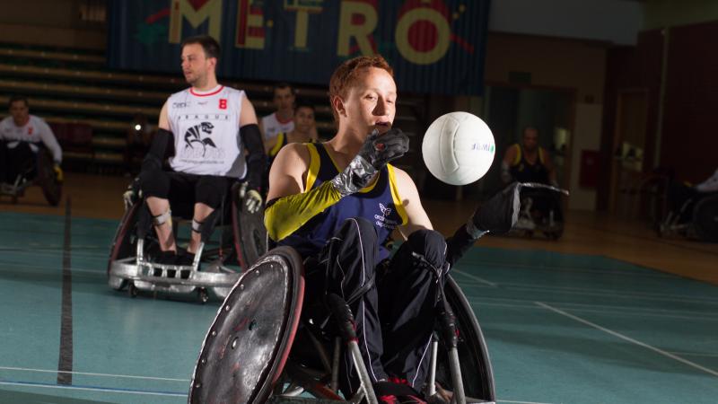 male wheelchair rugby player Carlos Neme with the ball