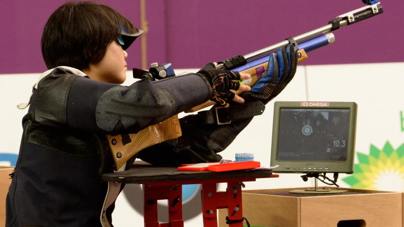 female Para shooter Cuiping Zhang looks at her target screen