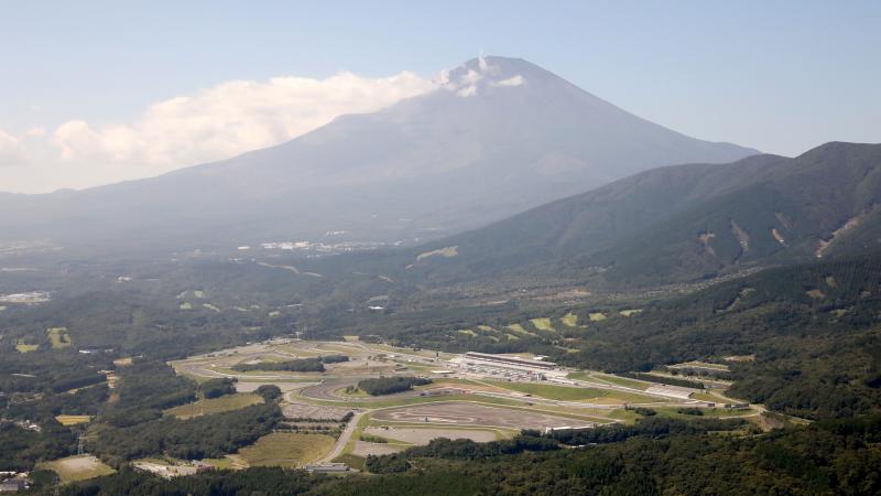 Motor racing circuit with a mountain in the background