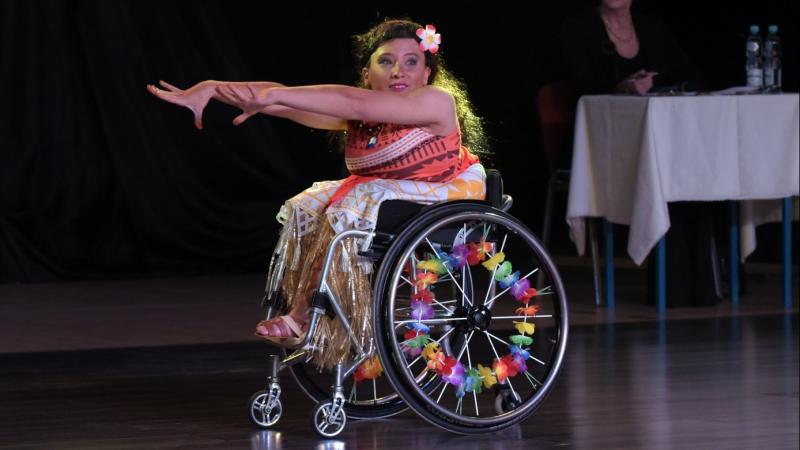 female Para dancer Julia Sadkowska stretches out her arms during a dance move