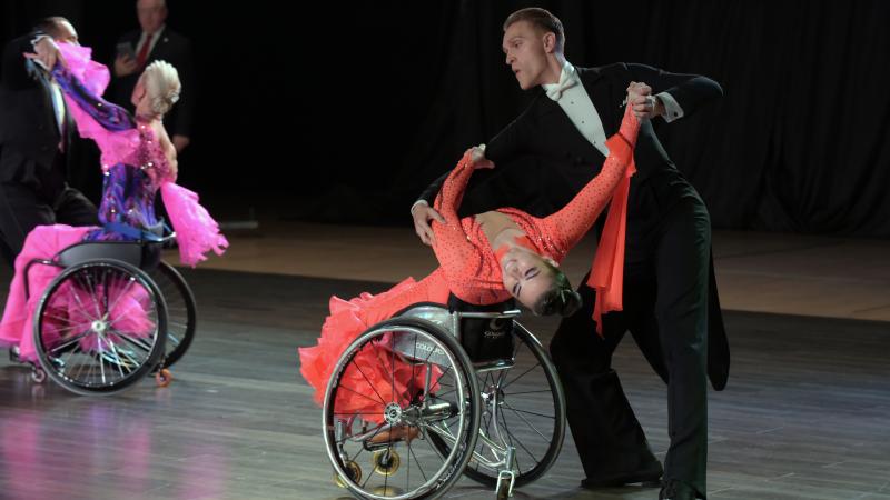Para dancers Hanna Harchakova and Roman Usmanov in a ballroom pose on the dance floor