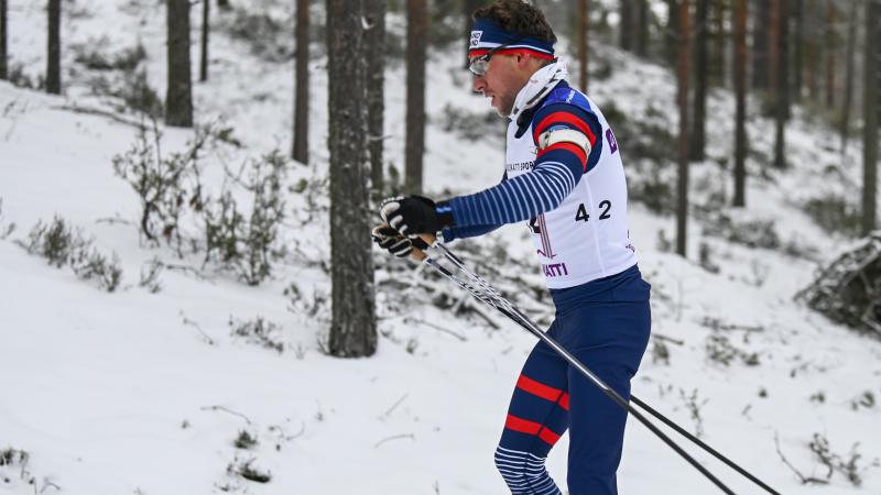 male Para Nordic skier Benjamin Daviet pushes through the snow