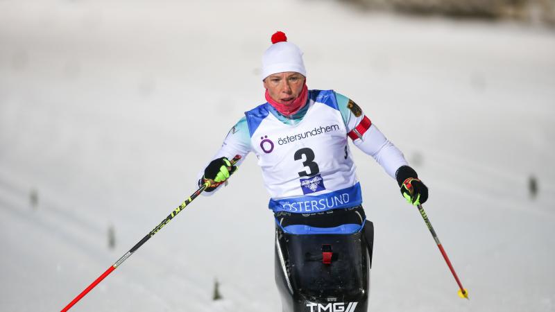 female Para Nordic skier Andrea Eskau steers on the ski course