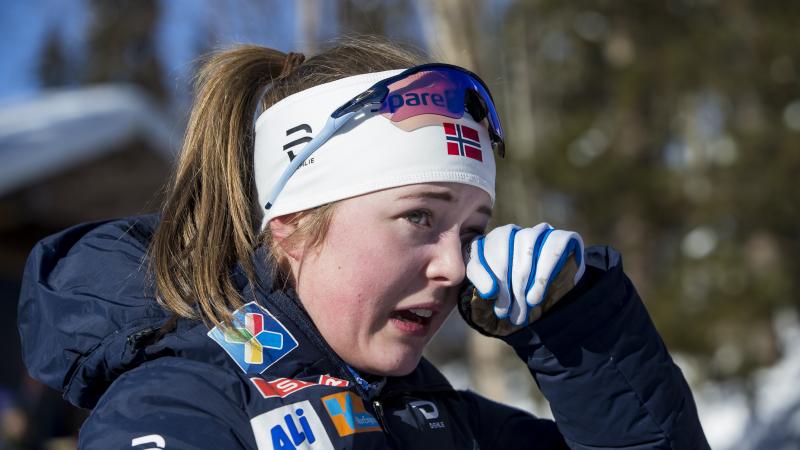 female Para Nordic skier Vilde Nilsen wipes away a tear