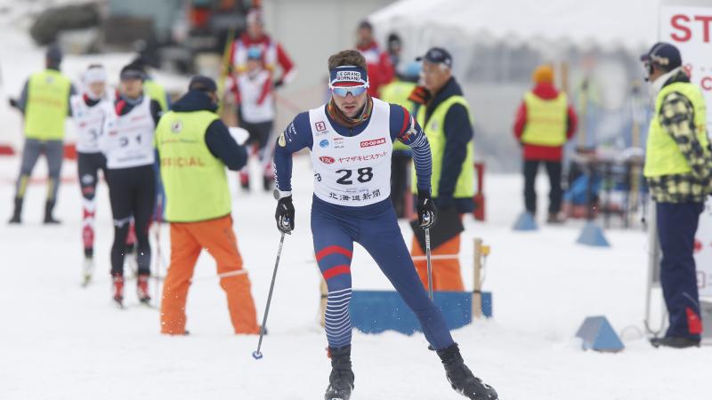male Para Nordic skier Benjamin Daviet skis towards the finish line