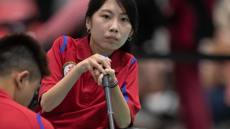 female boccia player Yuen Kei Ho watches a ball being played