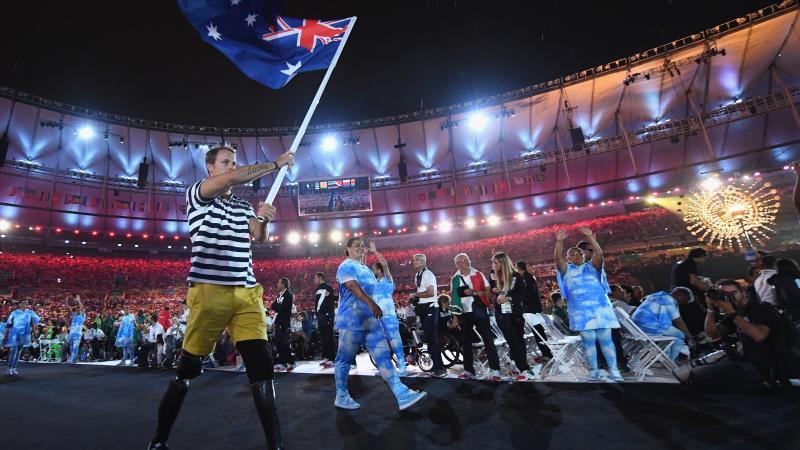Australian Paralympian Curtis McGrath carries the country's flag at the Opening Ceremony of Rio 2016