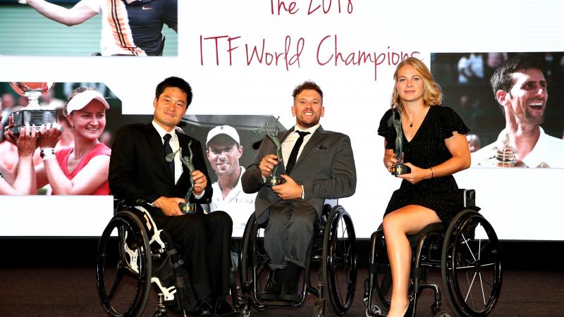 Shingo Kunieda, Dylan Alcott and Diede de Groot pose to the camera while holding their ITF World Champion awards