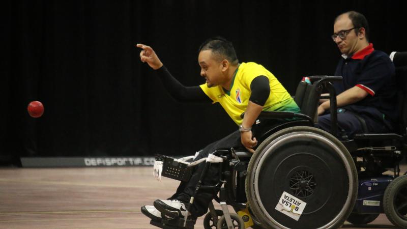 Brazilian boccia player in powerchair throws a ball