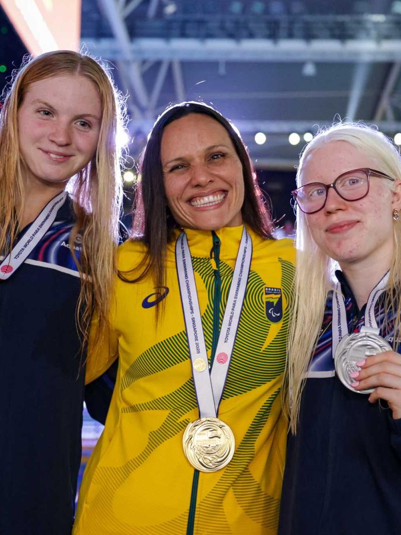 Three women showing their medals