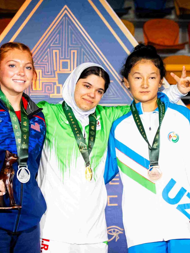 Athletes smile on podium