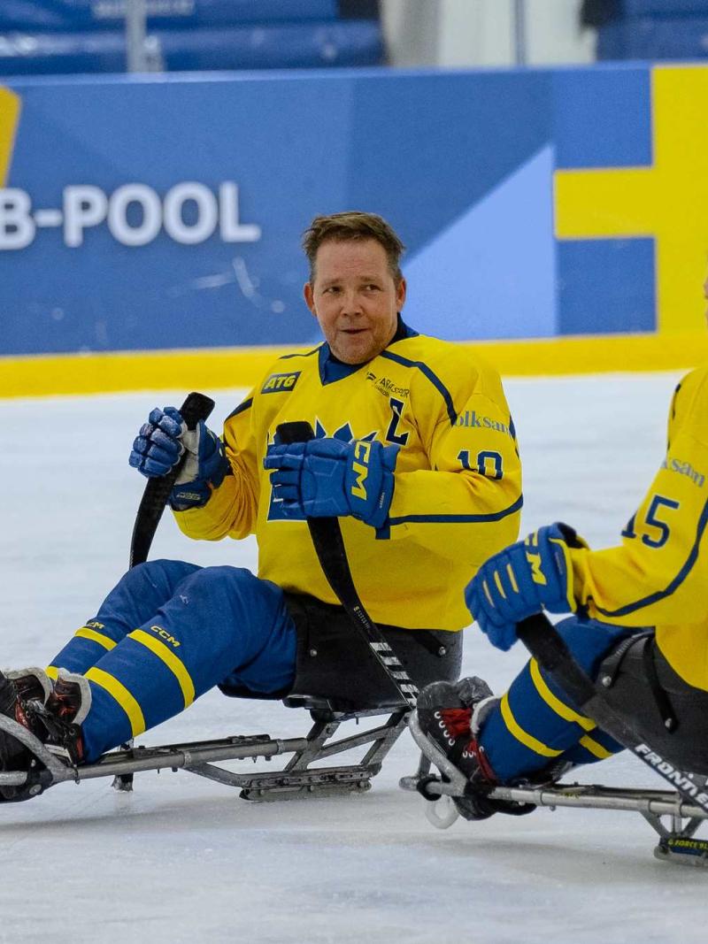 Para Ice hockey athletes in action