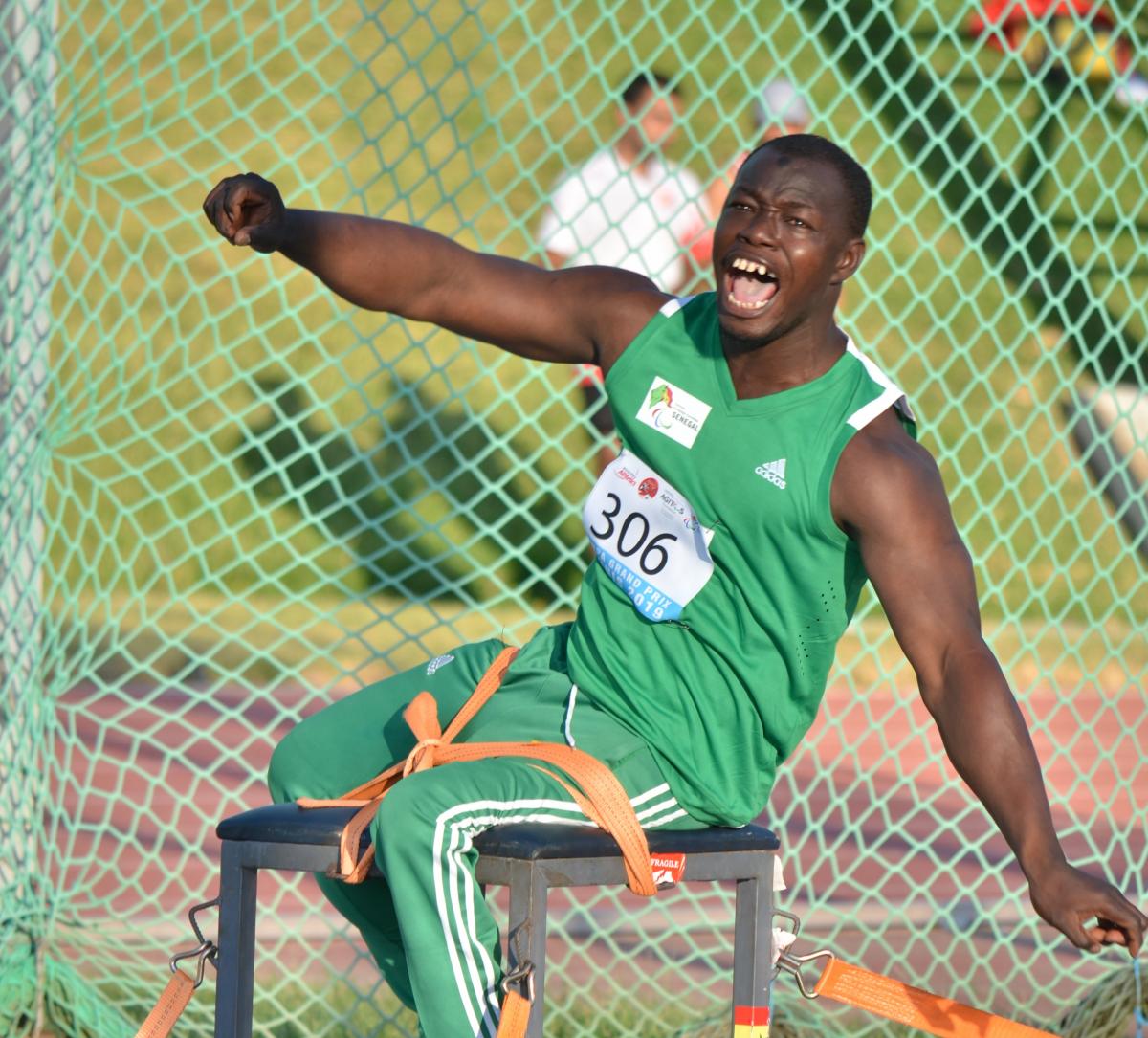 Black man yells after releasing discus