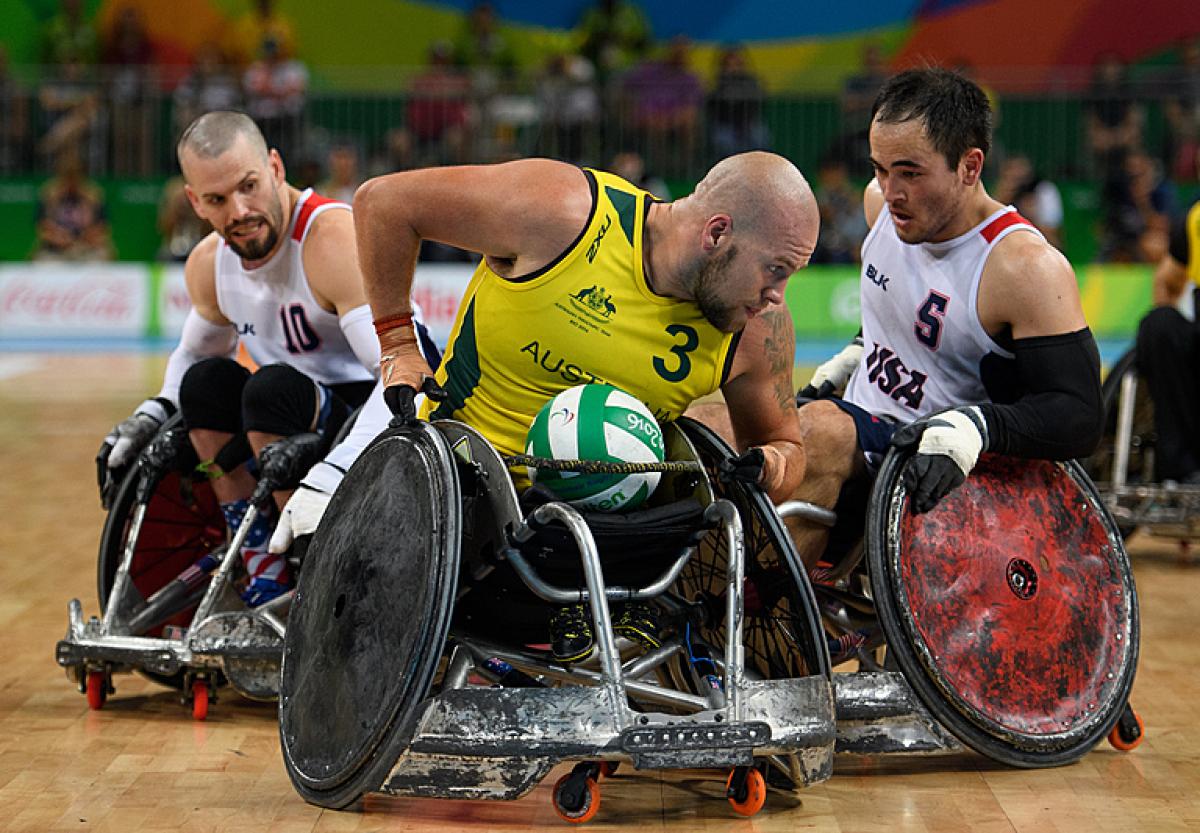 Ryley Batt tries to steer away from USA wheelchair rugby players