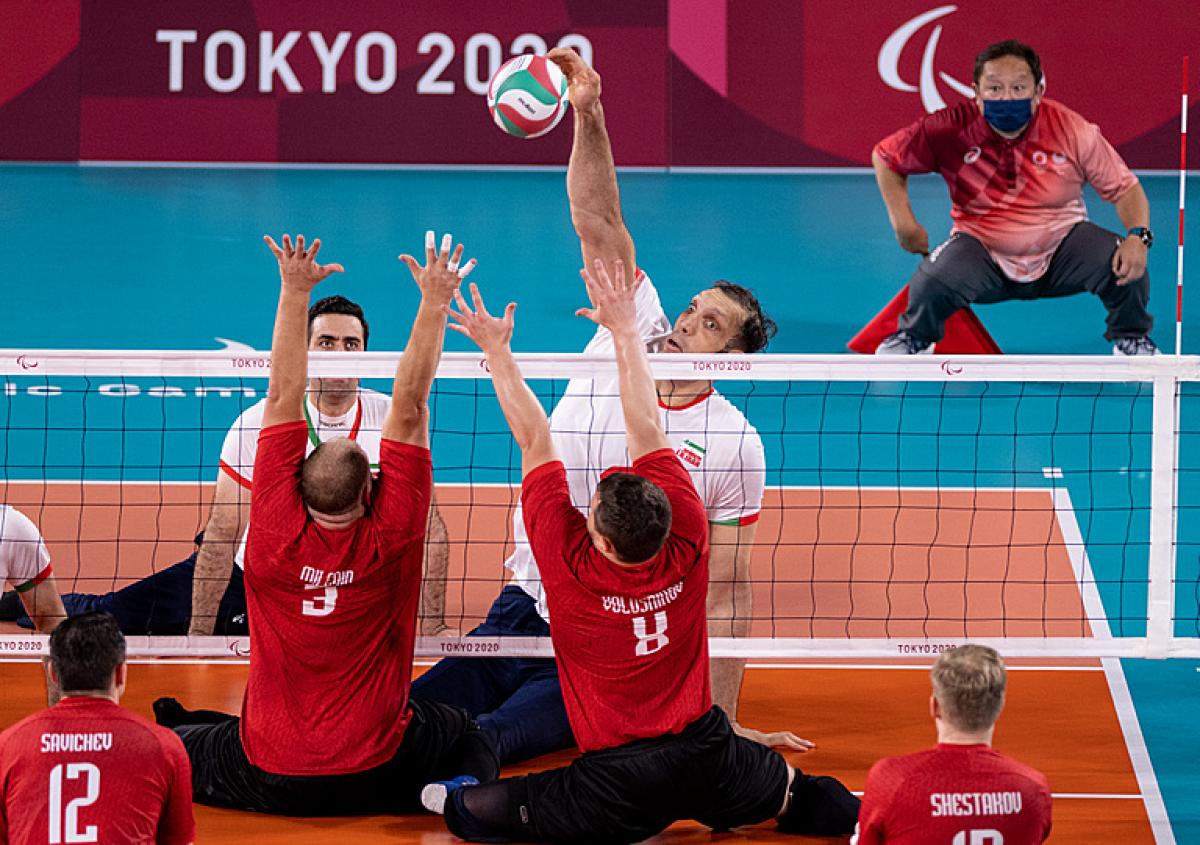 Iran's Morteza Mehrzadselakjani spikes the ball in a sitting volleyball game