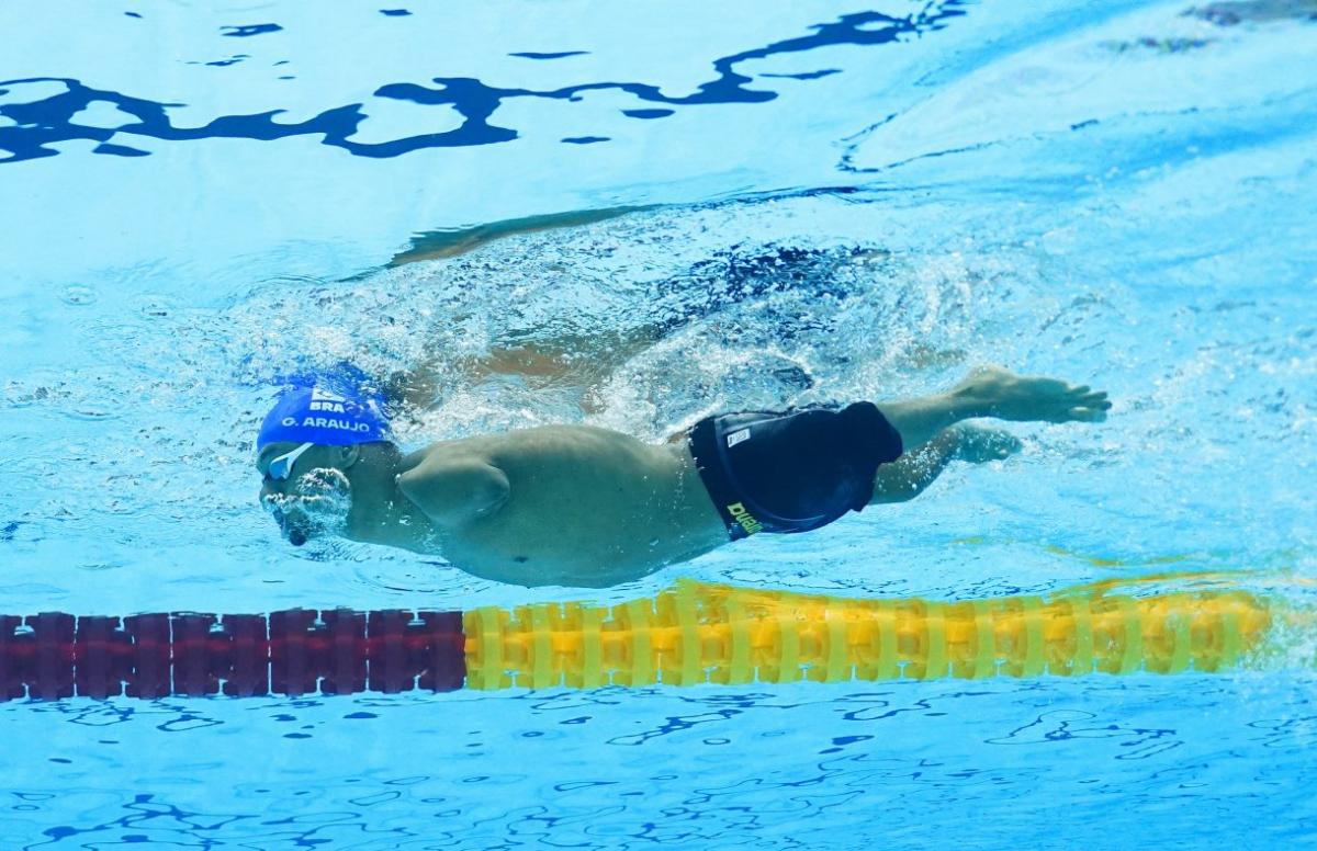 A male Para swimmer under water