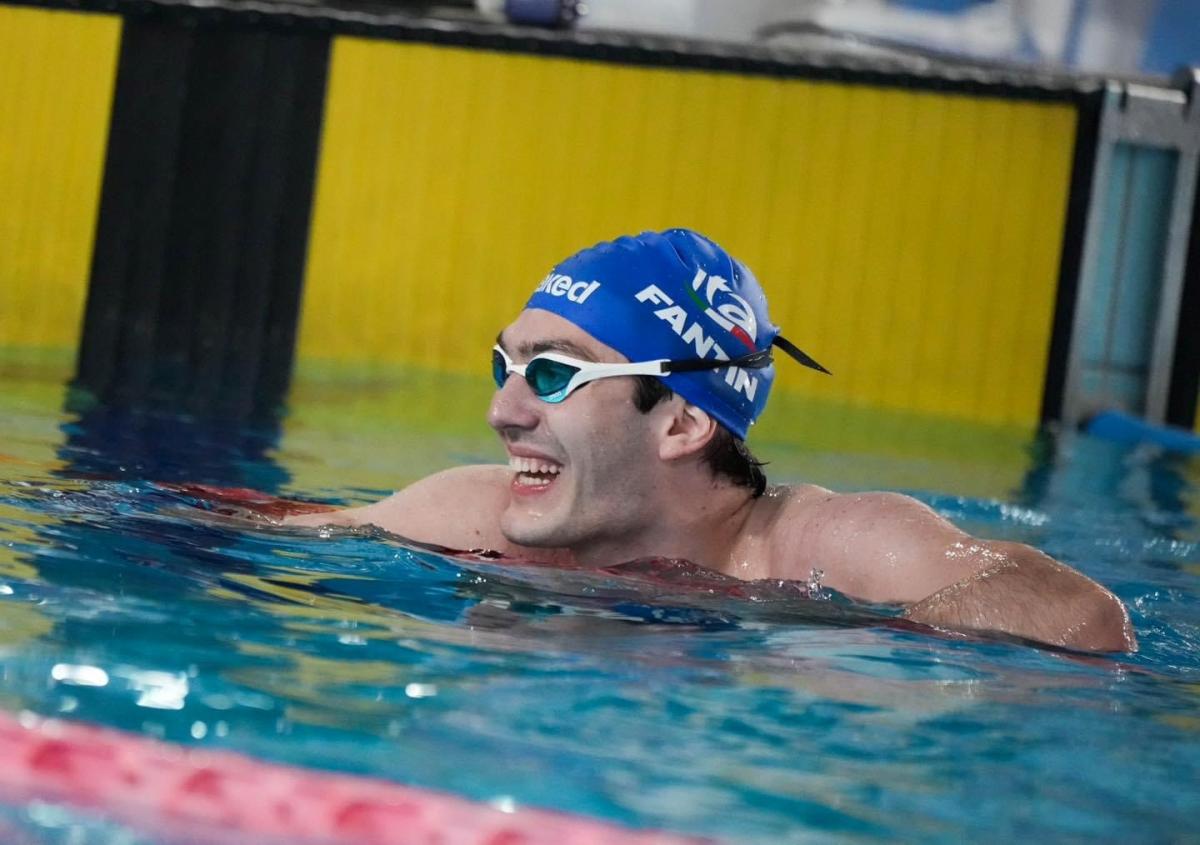A swimmer celebrates after a race.   