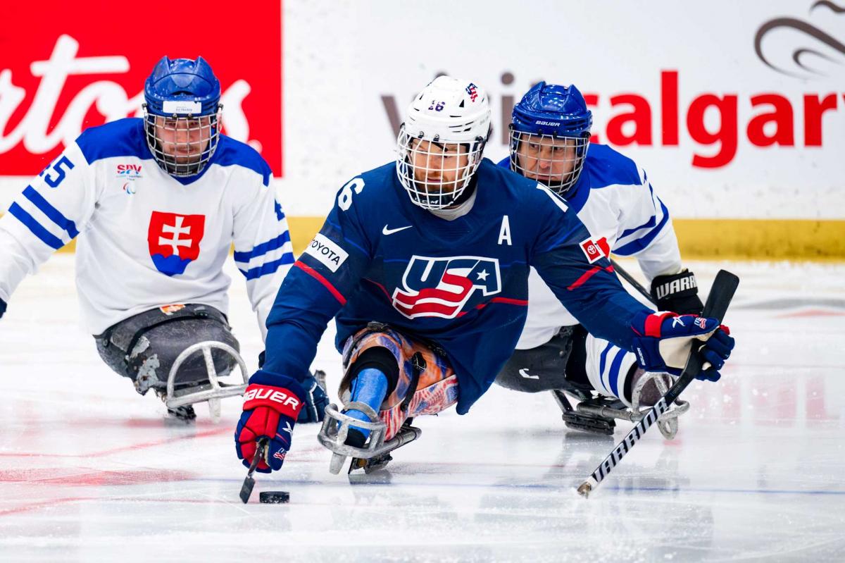 Para Ice hockey players in action. 