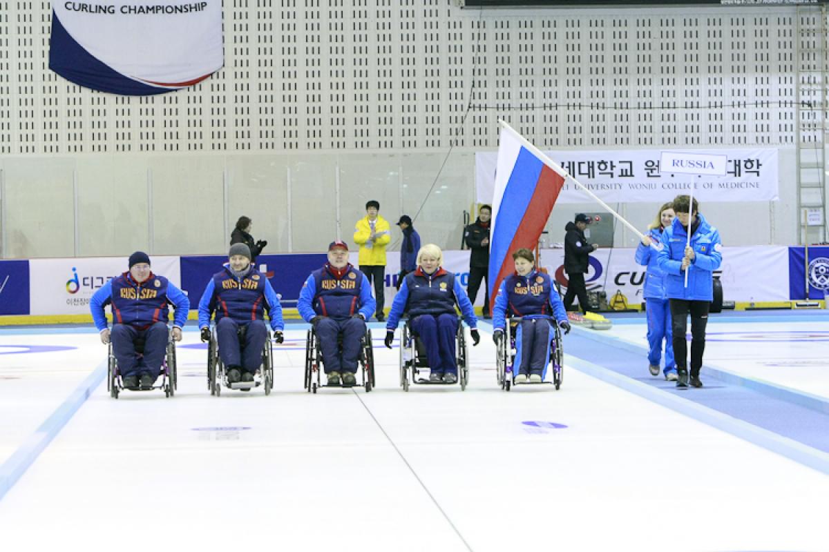 Gold winner Team Russia celebrating at the Medal Ceremony of the 2012 Wheelchair Curling World Championships in Chuncheon, Korea