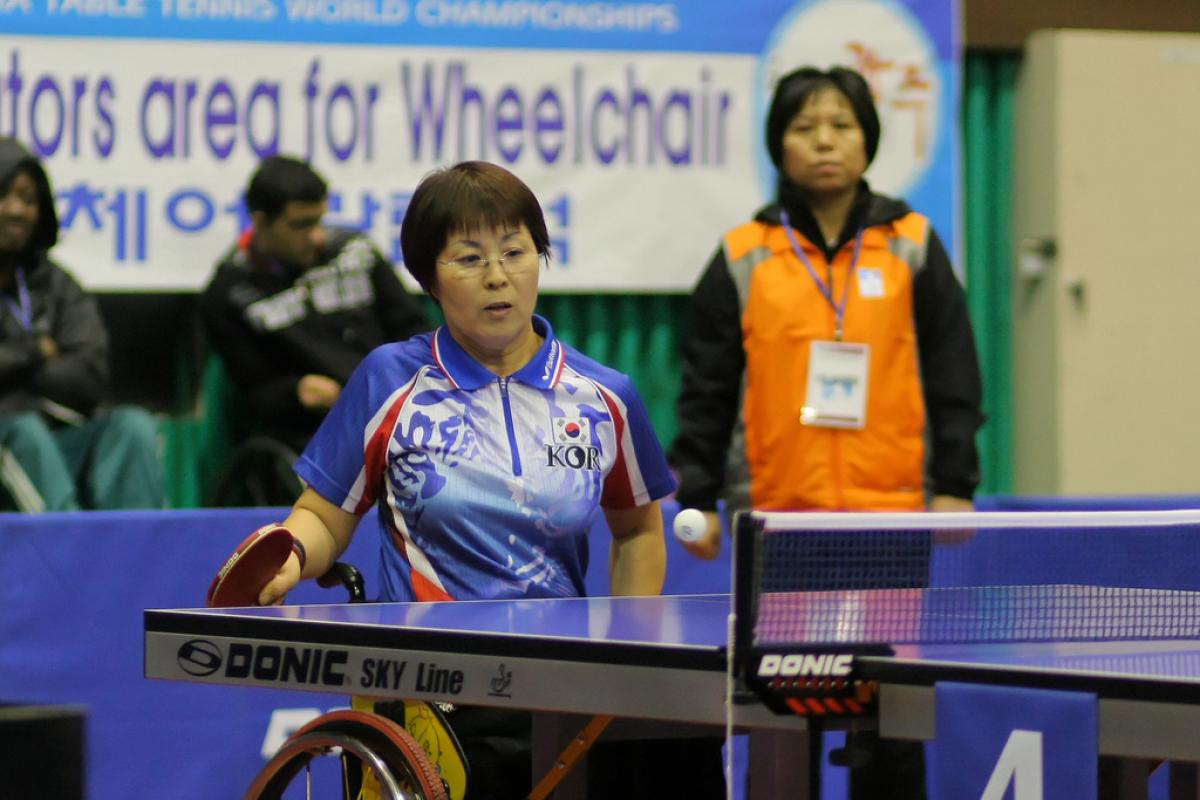 A Korean person is playing Table Tennis