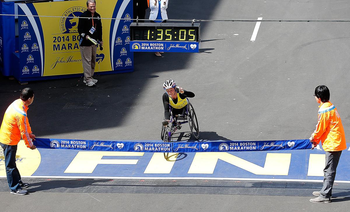 Tatyana McFadden Tatyana McFadden, a wheelchair racer, crosses the Boston Marathon finish line