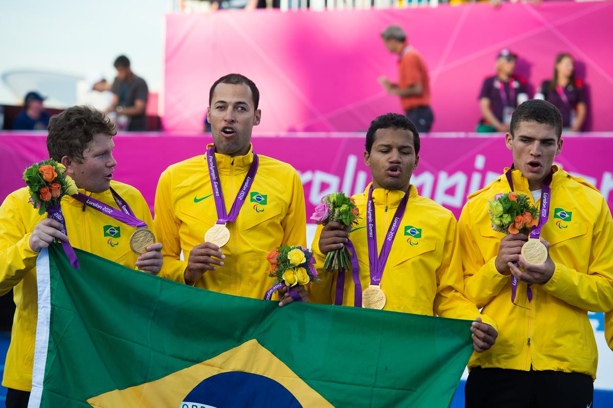 Members of the Brazilian team singing their national anthem during the victory ceremony